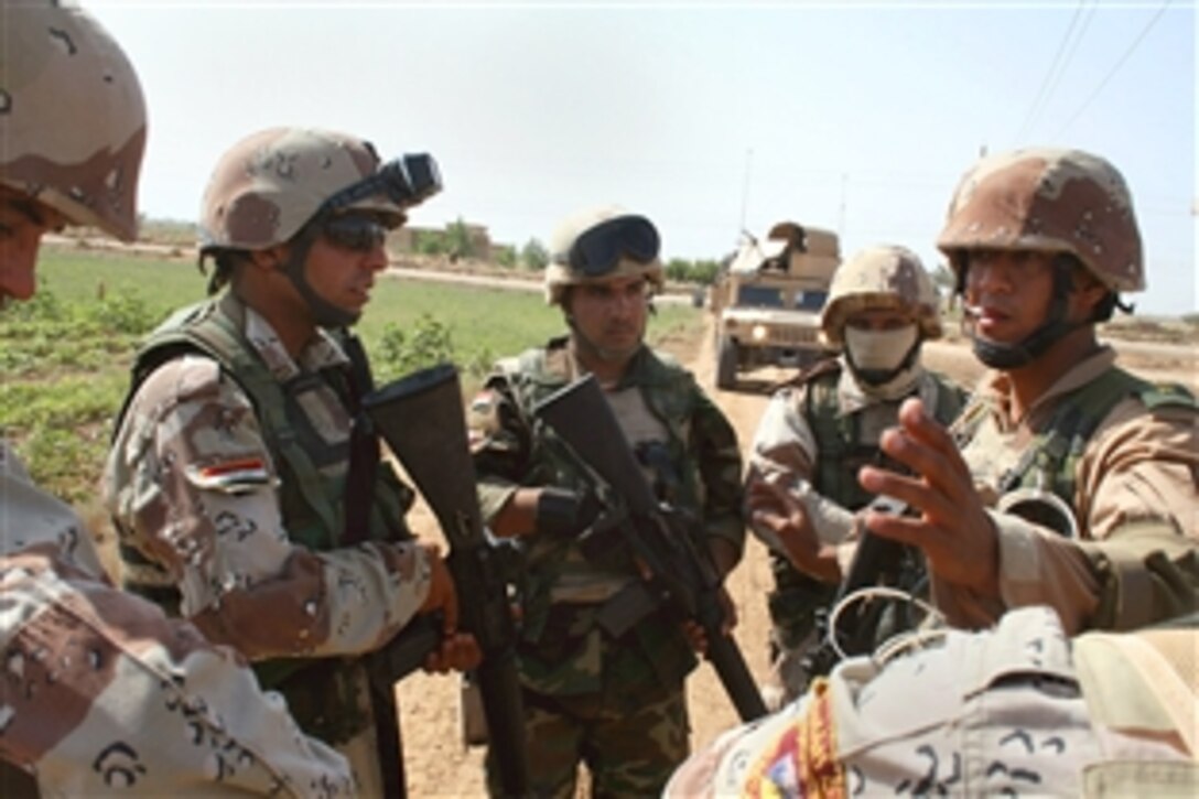 Iraqi army soldiers discuss the best plan to sweep an area during Operation Gunslinger Bonzai III in the Taji Qada, northwest of Baghdad, May 20, 2008. The Iraqi soldiers work with U.S. soldiers assigned to the 25th Infantry Division's 1st Battalion, 27th Infantry Regiment "Wolfhounds," 2nd Stryker Brigade Combat Team, Multinational Division Baghdad.