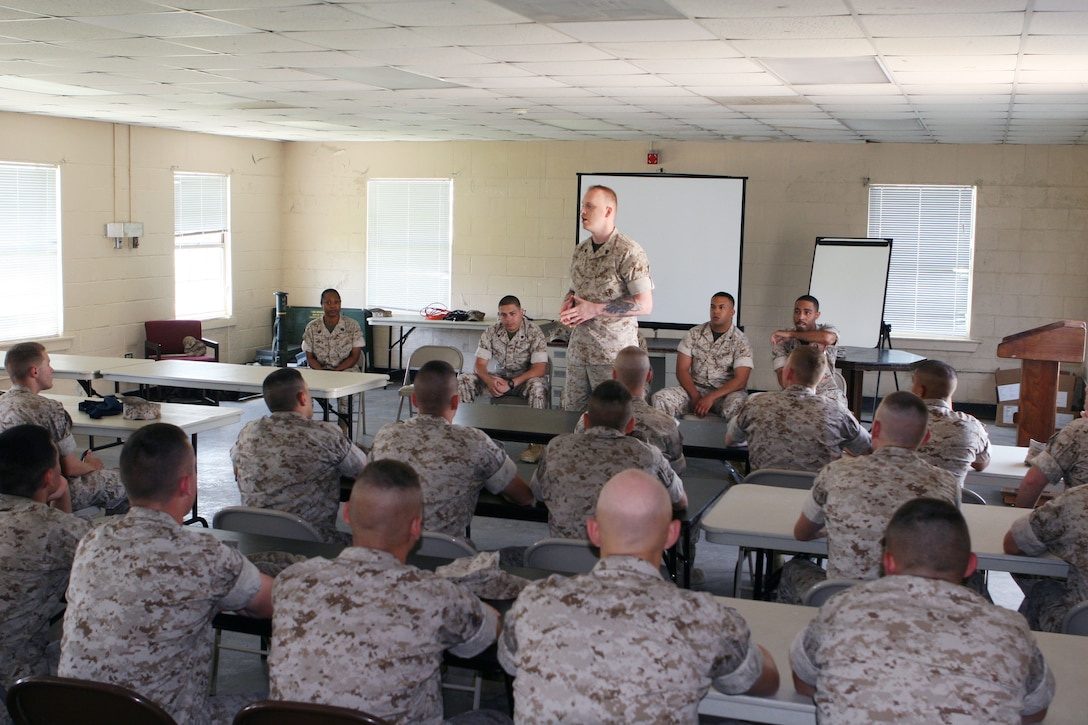 Sgt. Jack Durgala, a Marine with Wounded Warrior Battalion-East, Wounded Warrior Regiment, Manpower and Reserve Affairs, speaks to Marines from Student Administrative Company, School of Infantry, about his injuries here May 29. Durgala and five other wounded warriors spoke to the Marines about staying motivated after an injury.