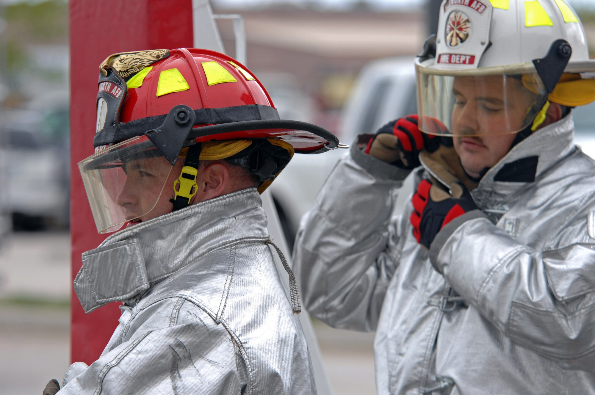 (Left) Staff Sgt. Adam Martin, 28th Civil Engineer Squadron fire inspector, and Tech Sgt. Arley Paulus, 28 CEF assistant chief of training, participate in the final round of the Firefighter Challenge here, May 28. Team Readiness won the FireFighter challenge against the eight teams that advanced to the final round. (U.S. Air Force photo/Airman Corey Hook)