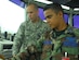 SOTO CANO AIR BASE, Honduras--Air Force Staff Sgt. Jose Pastrana and Honduran air force Sgt. Gerardo Machado work together controlling airfield movement from the tower here. Tower controll Airmen here work daily in a combined multi-national military environment and are required to speak fluent Spanish. (U.S. Air Force photo  by Tech. Sgt. William Farrow)