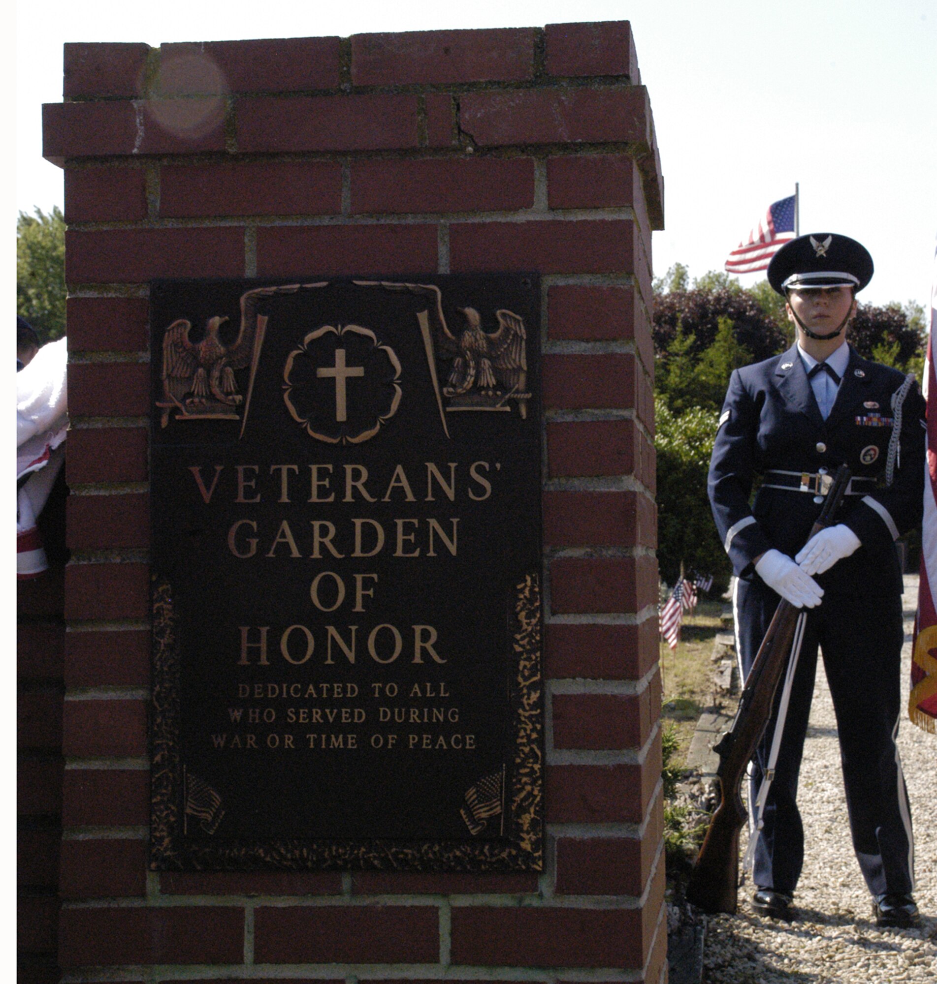 Airman 1st Class Kira Otero, Dover Air Force Base Honor Guard, stands at attention before marching through the Veterans Garden of Honor at the Sharon Hills Memorial Park, Dover, Del., during a Memorial Day ceremony. (U.S. Air Force photo/Airman 1st Class Shen-Chia Chu)