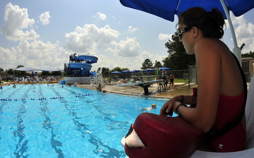 Lauren Raulerson, Outdoor Pool lifeguard, watches swimmers here May 30. The pool is now open for the summer to provide a place for Moody members of all ages to cool off. (U.S. Air Force photo by Senior Airman Elizabeth Rissmiller)