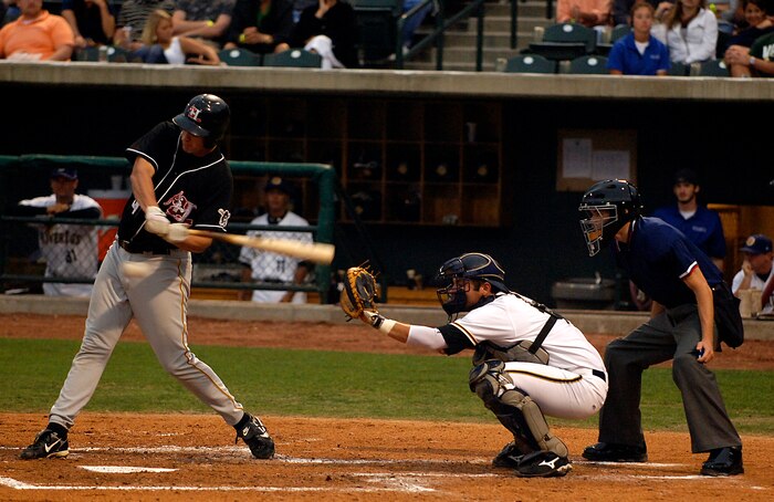 Bobby Spain swings at a ball during a Charleston Riverdogs game at Joseph P. Riley Jr. Park in Charleston, S.C., May 29. The Riverdogs and Force Protection Industries Inc. organizations donated free tickets to thousands of base Airmen and family members to attend the game as a small token of appreciation for their service. Spain is a third-base man for the Hickory Crawdads. (U.S. Air Force photo/Senior Airman Nicholas Pilch)