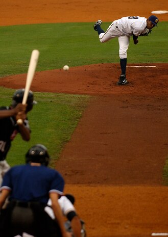 Jairo Heredia throws a pitch to Austin McClune during a Charleston Riverdogs game at Joseph P. Riley Jr. Park in Charleston, S.C., May 29. The Riverdogs and Force Protection Industries Inc. organizations donated free tickets to thousands of base Airmen and family members to attend the game as a small token of appreciation for their service. Heredia is a pitcher for the Charleston Riverdogs and McClune is a right-fielder for the Hickory Crawdads. (U.S. Air Force photo/Senior Airman Nicholas Pilch)