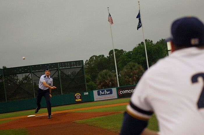 Col. Joseph Mancy throws the first pitch before the Charleston Riverdogs game at Joseph P. Riley Jr. Park in Charleston, S.C., May 29. The Riverdogs and Force Protection Industries Inc. organizations donated free tickets to thousands of base Airmen and family members to attend the game as a small token of appreciation for their service. Colonel Mancy is the 437th Operations Group commander. (U.S. Air Force photo/Senior Airman Nicholas Pilch)