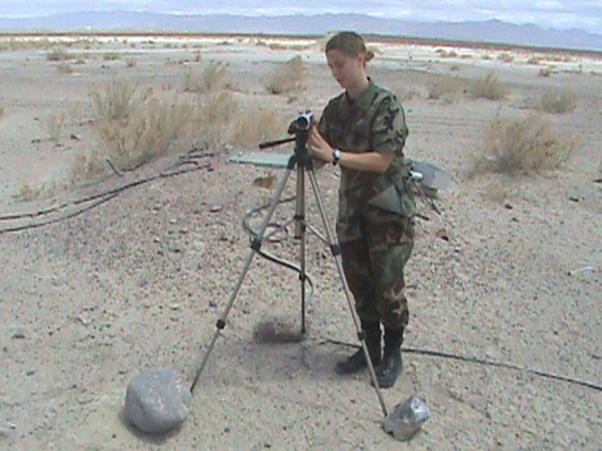 HILL AIR FORCE BASE, Utah -- Second Lt. Audrey Stock, 86 Fighter Weapons Squadron Weapons and Tactics Analyst, checks a camera at one of the target areas on the Utah Test and Training Range to see if it captured the hit of a air-to-ground weapon during a recent Weapons Evaluation System Program.               