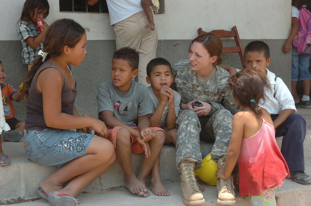 U.S. Army First Lieutenant Francis Lamb a Personnel Officer with 301st Reserve Support Group sits down to talk with school children in La Granja, Honduras, where U.S. and Honduran Soldiers are renovating their school, May 2, 2008.  The renovation project is part of Beyond the Horizons, a joint training exercise designed to provide missions that improve the quality of life for the local populace while fostering partnership between U.S. and Honduran forces. (U.S. Army photo by Staff Sergeant Sean A. Foley)(Released)