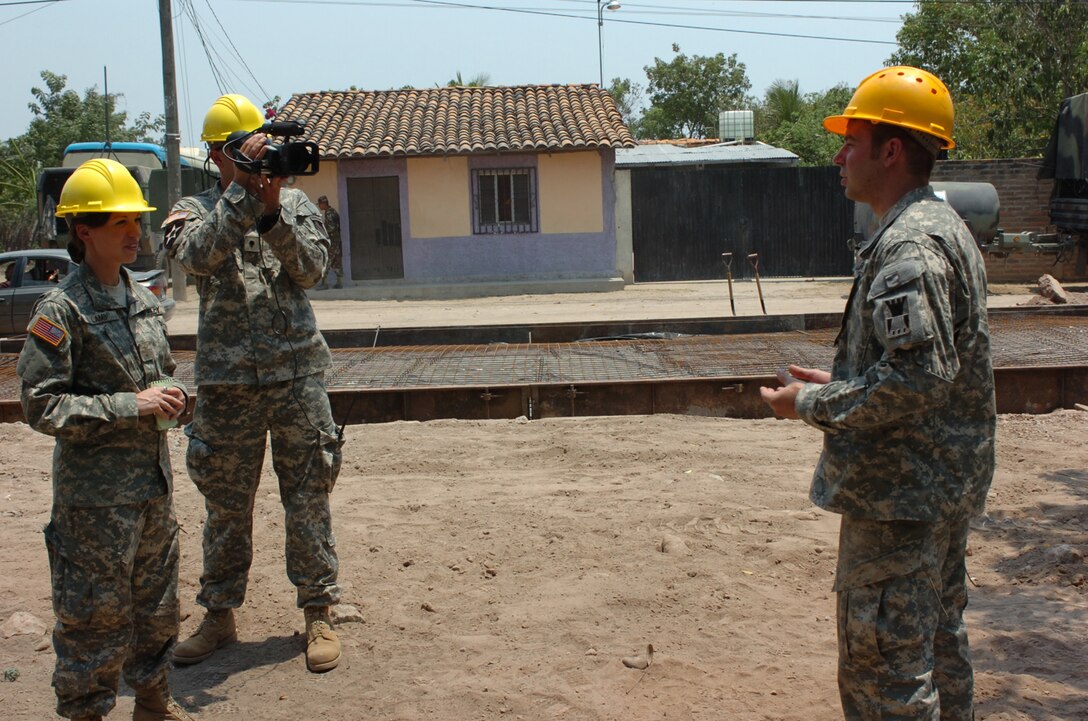 U.S. Army First Lieutenant Francis Lamb an Officer with 301st Reserve Support Group, and Davis Pridgen, a Documentation Specialist with 982d Combat Camera (Airborne), record an interview with Sergeant Steven Wincentsen, an engineer with 389th Engineering Company, at a renovation site in La Granja, Honduras, May 2, 2008.  The renovation project is part of Beyond the Horizons, a joint training exercise designed to provide missions that improve the quality of life for the local populace while fostering partnership between U.S. and Honduran forces. (U.S. Army photo by Staff Sergeant Sean A. Foley)(Released)