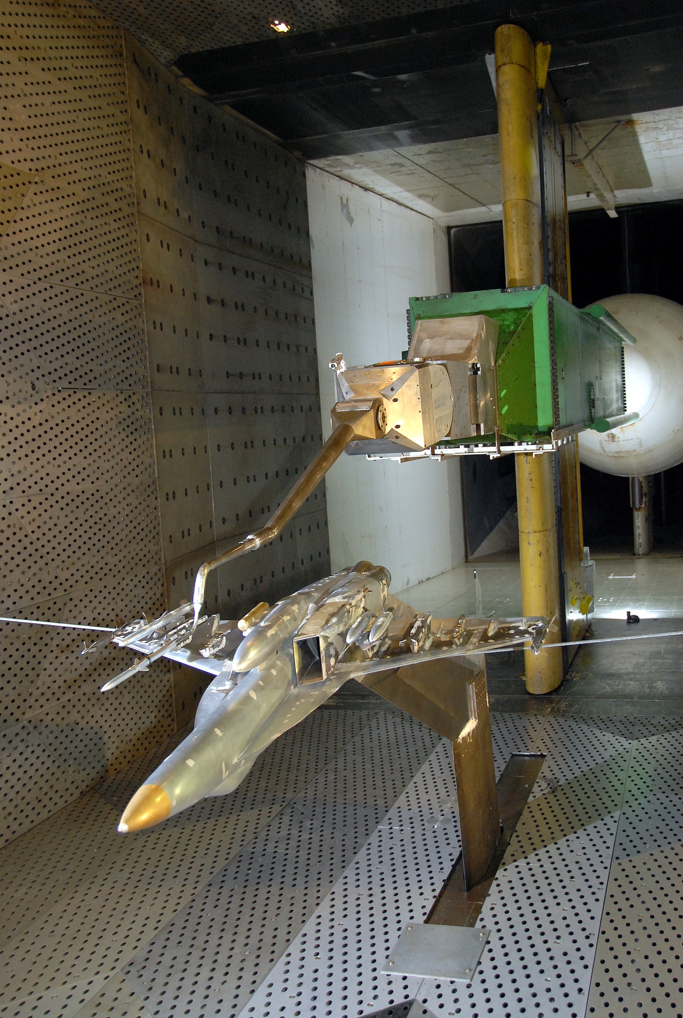 This is a view of 1/10-scale sting-mounted AIM-120C store and F/A-18E/F aircraft models during a break in store separation testing inside AEDC’s 16-foot transonic wind tunnel. (Photo by David Housch)