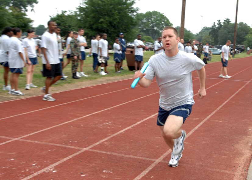 BARKSDALE AIR FORCE BASE, La. - Senior Airman Austin Smith from 2d Bomb Wing Staff runs the final leg of a four man relay during a wing sports day held at the Fitness Center here on May 22. (U.S. Air Force photo by Staff Sgt. Trina Jeanjacques)
