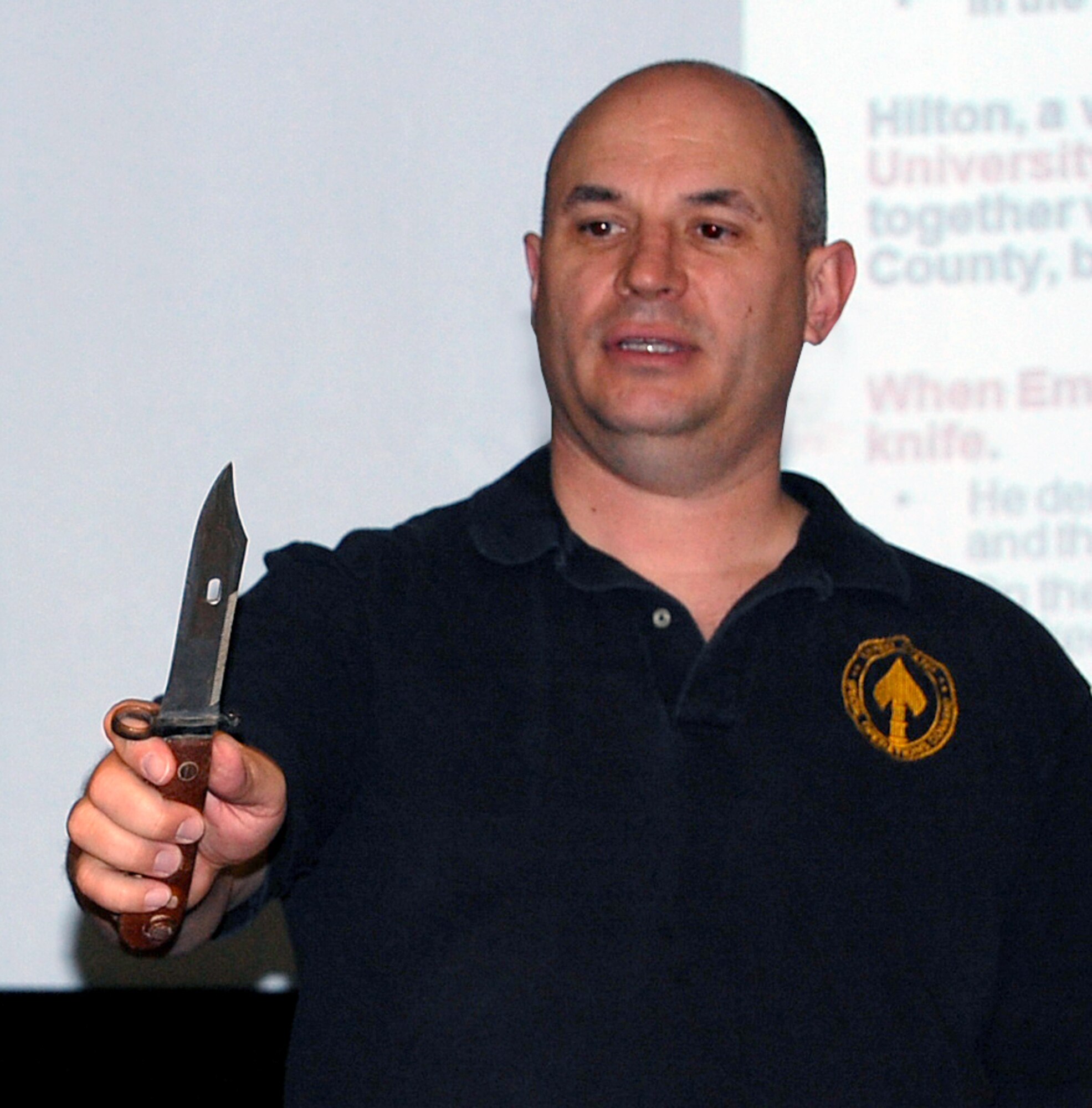 Maj. Kurt Schuh displays a bayonet from an AK-47 during the I DEFEND course May 16. Major Schuh showed the knife during a discussion about criminal threats to provide particpants with perspective of what a "military-style" knife looks like. (U.S. Air Force photo/Ellen Edwards)