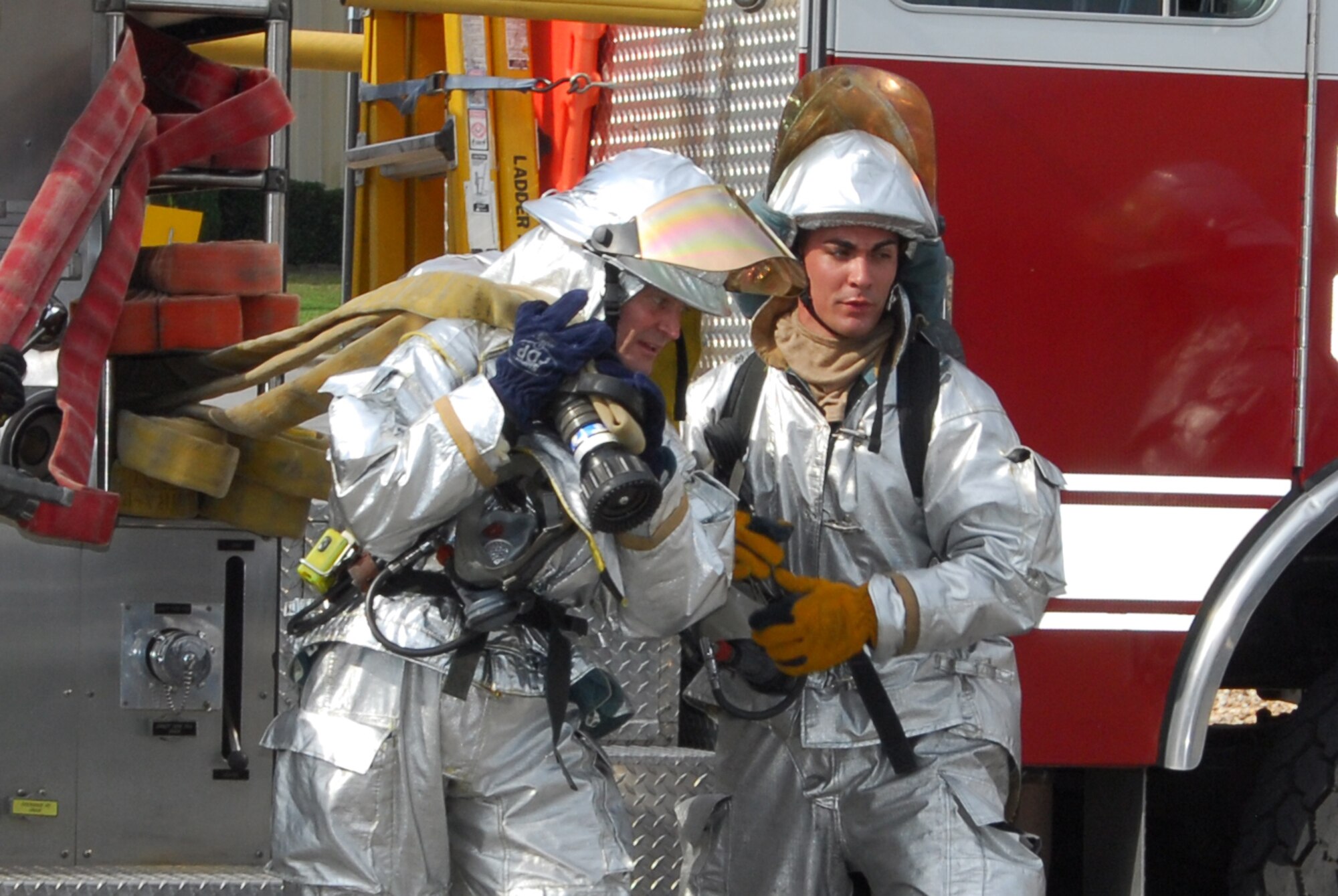Col. Darryl Roberson, 325th Fighter Wing commander, shadows Airman 1st Class Nicholas Lezza, 325th Fire and Emergency Services firefighter, during a structural fire exercise. Airman Lezza, who serves a first responder to fire incidents and other emergencies at Tyndall Air Force Base, was selected for the Commander’s Shadow Program by the 325th Mission Support Group.  “Airman Lezza is a true go-getter who is always looking for ways to improve the mission and puts safety first while performing firefighting duties,” said Staff Sgt. Mariela Miles, Airman Lezza’s supervisor. Serving the Air Force for over two years, Airman Lezza hails from Bellwood, Ill. (U.S. Air Force photo/Lisa Norman)