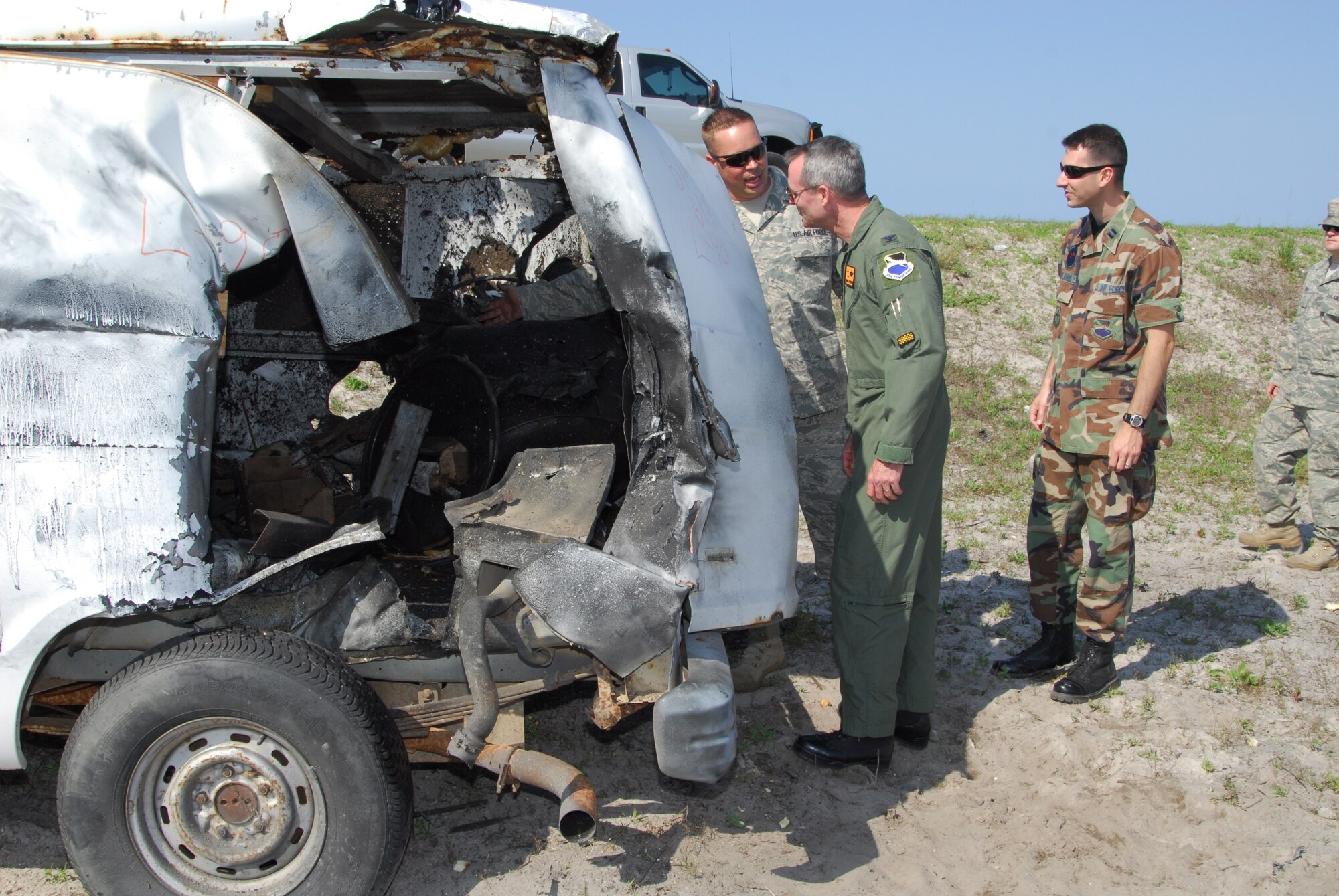 Capt.  Robert J. Orlando, 325th Medical Support Squadron, observes Tech. Sgt. Nathan Walch, 325th Civil Engineer Squadron explosives ordnance disposal craftsman, giving an EOD demonstration to Col. Darryl Roberson, 325th Fighter Wing commander, as part of the Commander’s Shadow program.  Captain Orlando, a resource management flight commander, is a native of North Massapequa, N.Y.  He spent the day with shadowing the commander to learn about wing operations.  “Captain Orlando is a true go-getter who is always looking for ways to improve the mission, streamline operations, and plan for the future,” Lt. Col. Cynthia L. Lee, Captain Orlando’s supervisor. (U.S. Air Force photo/Lisa Norman)