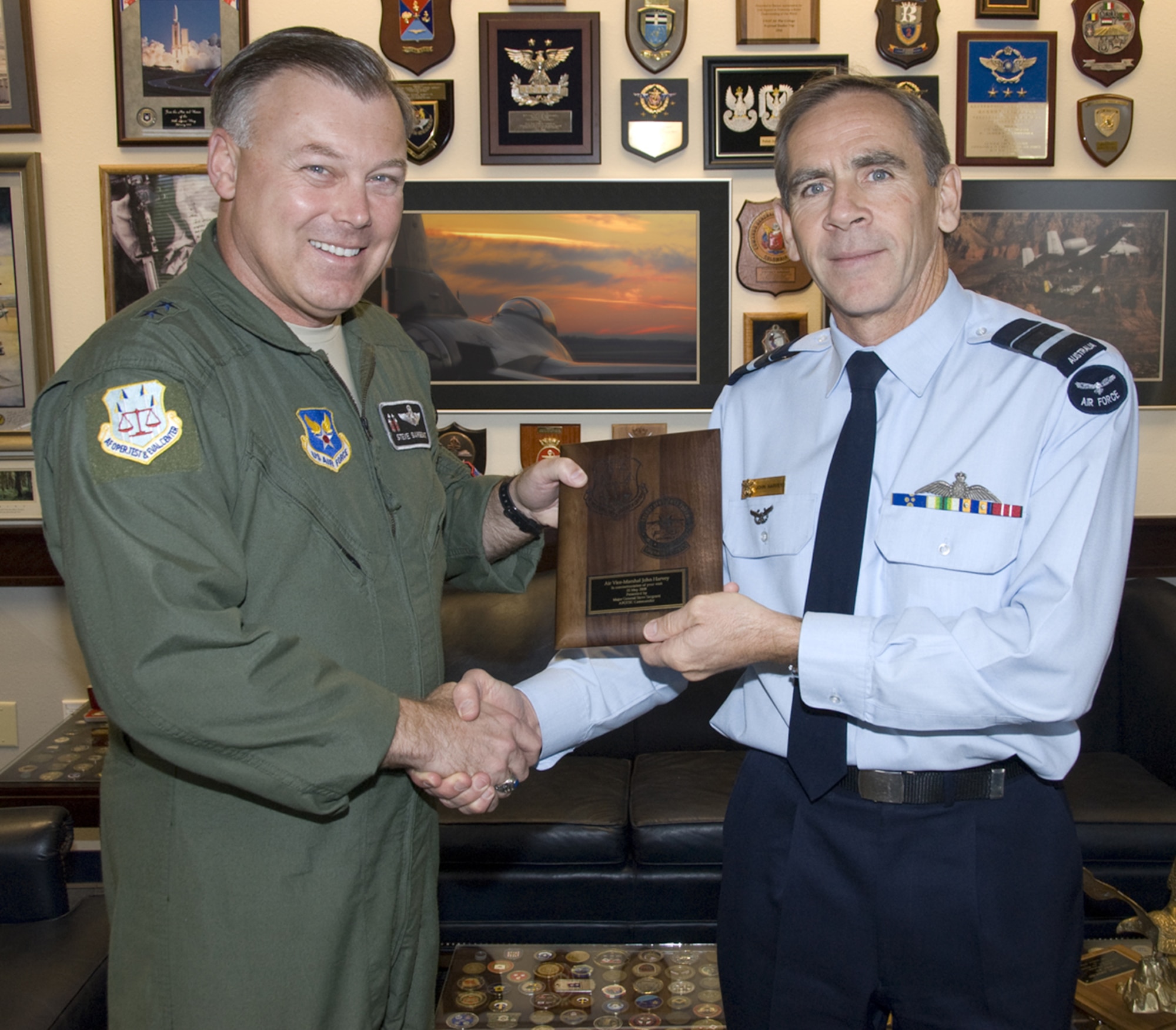 (Left) Air Force Operational Test and Evaluation Center Commander Maj. Gen. Stephen T. Sargeant presents Air Vice Marshal John Harvey of the Royal Australian Air Force with a plaque during his visit to AFOTEC Headquarters at Kirtland Air Force Base, N.M. on May 22.