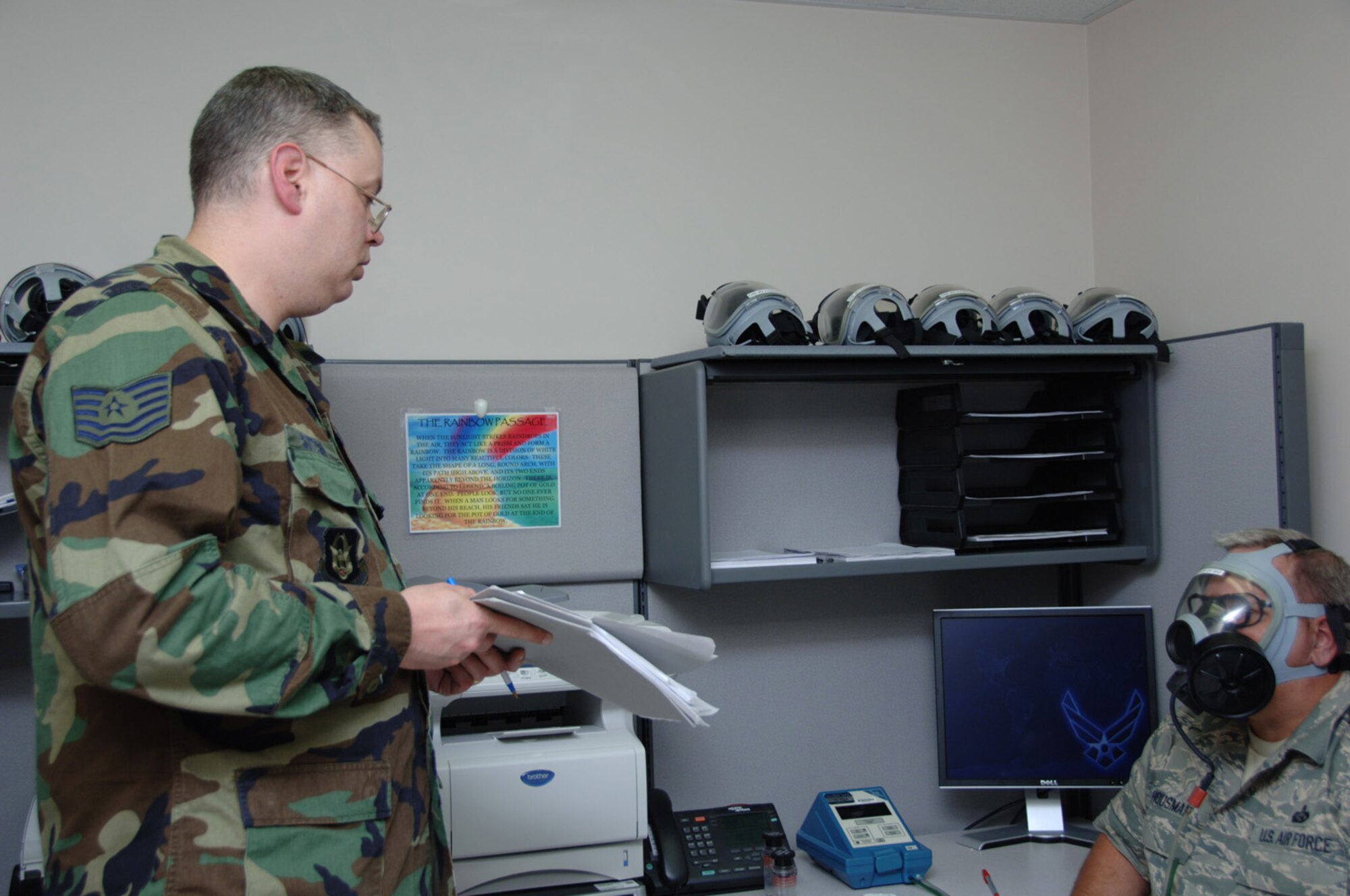 Tech. Sgt. John E. Sutton Jr. evaluates the gas mask fitting of Senior Master Sgt. Mack Housman during the May Unit Training Assembly.  Sergeant Sutton, a bioenvironmental engineering craftsman for the 931st Aerospace Medicine Flight, is scheduled to retire from the Air Force Reserve in June.  Sergeant Housman is the superintendent of the 931st's Military Personnel Flight. (U.S. Air Force photo/Senior Airman Connor Burkhard)