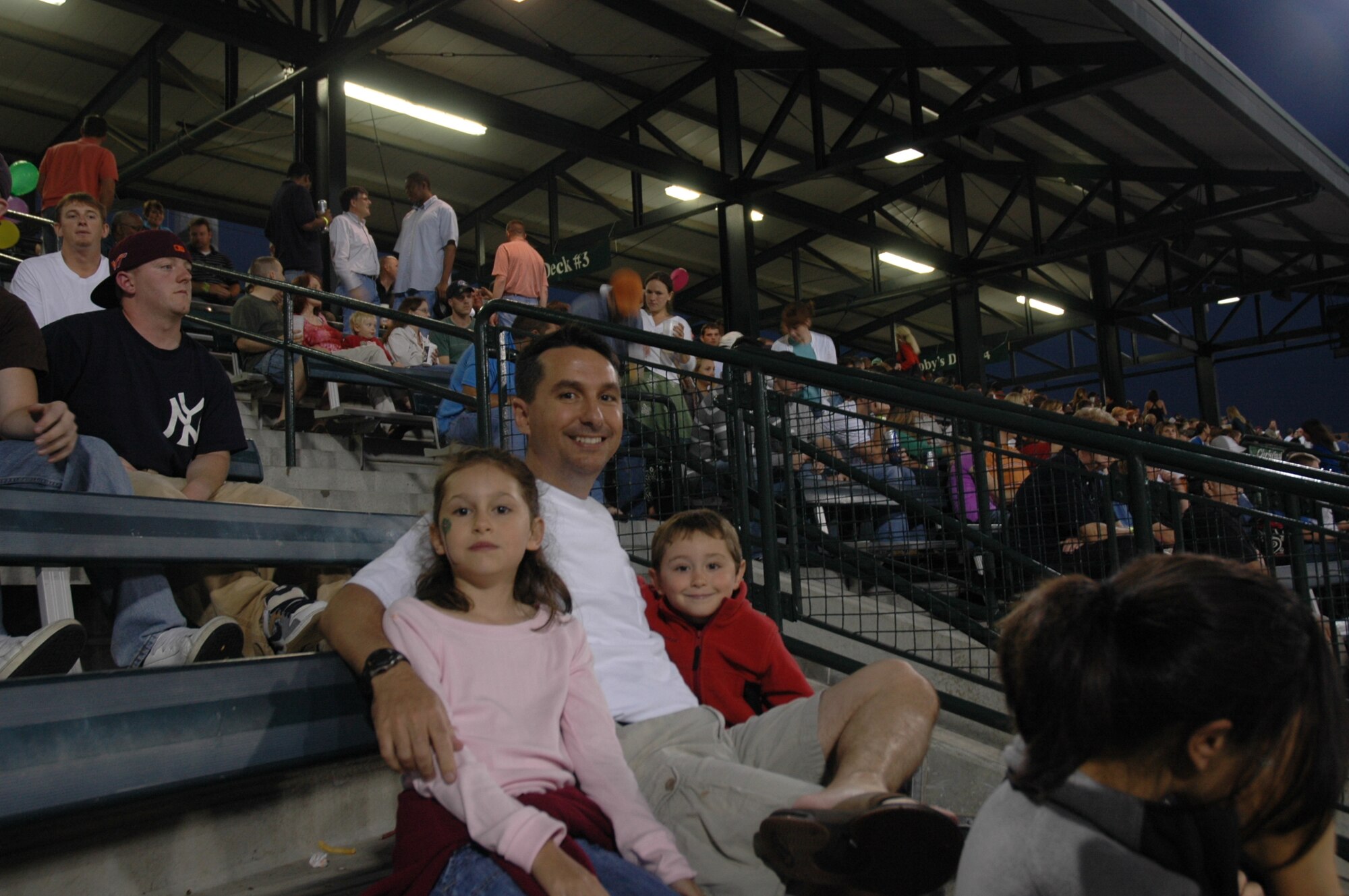 Maj. Mike Cottone, 315th Airlift Wing flight safety officer, enjoys a Charleston Riverdogs game with his daughter Addison, 8, and son Chase, 5, May 29. The game was a part of the team's Military Appreciation Night. The Riverdogs defeated the Hickory Crawdads 2-1. (Photo by Capt. Bryan Lewis)