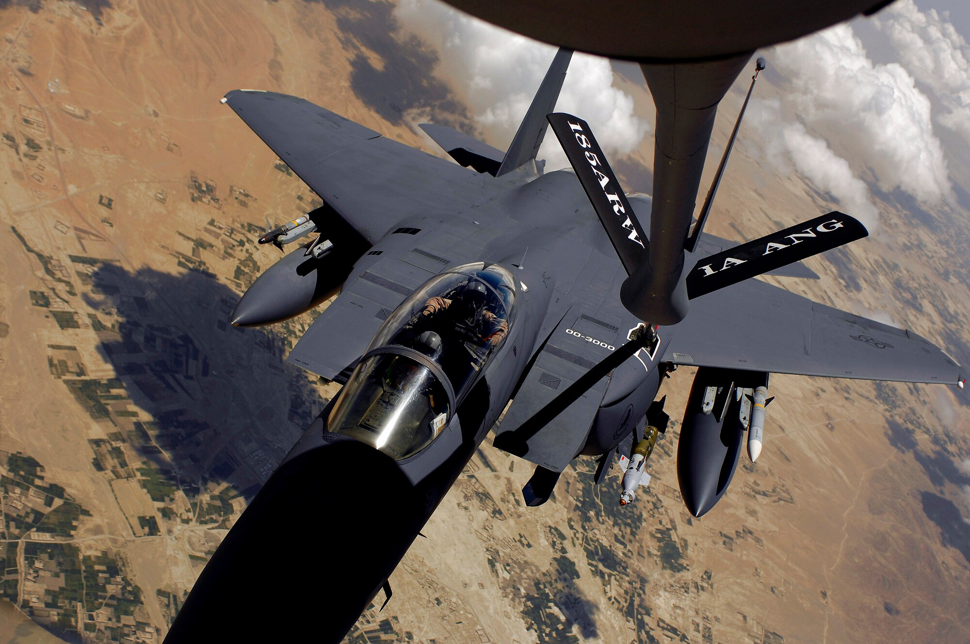 An F-15E Strike Eagle aircraft moves into position for fuel from a KC-135R Stratotanker during a mission over Afghanistan. (U.S. Air Force photo/Master Sgt. Andy Dunaway) 