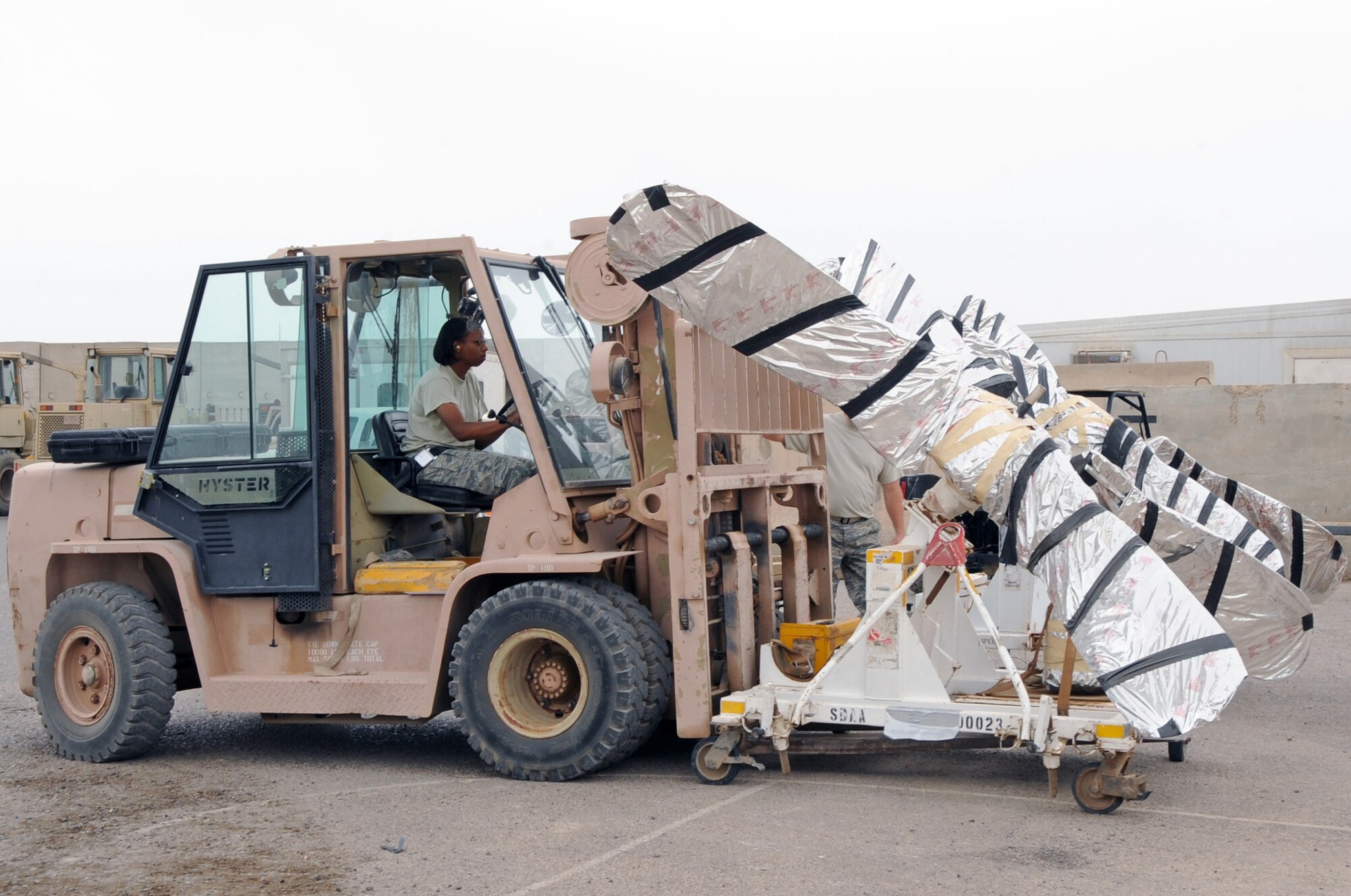 ALI BASE, Iraq -- Staff Sgt. Sapira Walker, hazardous cargo specialist, prepares several Navy P-3 Orion propellers for shipment May 30. The Traffic Management Office is responsible for preparing, packaging, shipping and receiving of all outbound cargo here. Sergeant Walker is deployed to the 407th Expeditionary Logistics Readiness Squadron from Luke AFB, Ariz. (U.S. Air Force photo/Tech. Sgt. Sabrina Johnson)