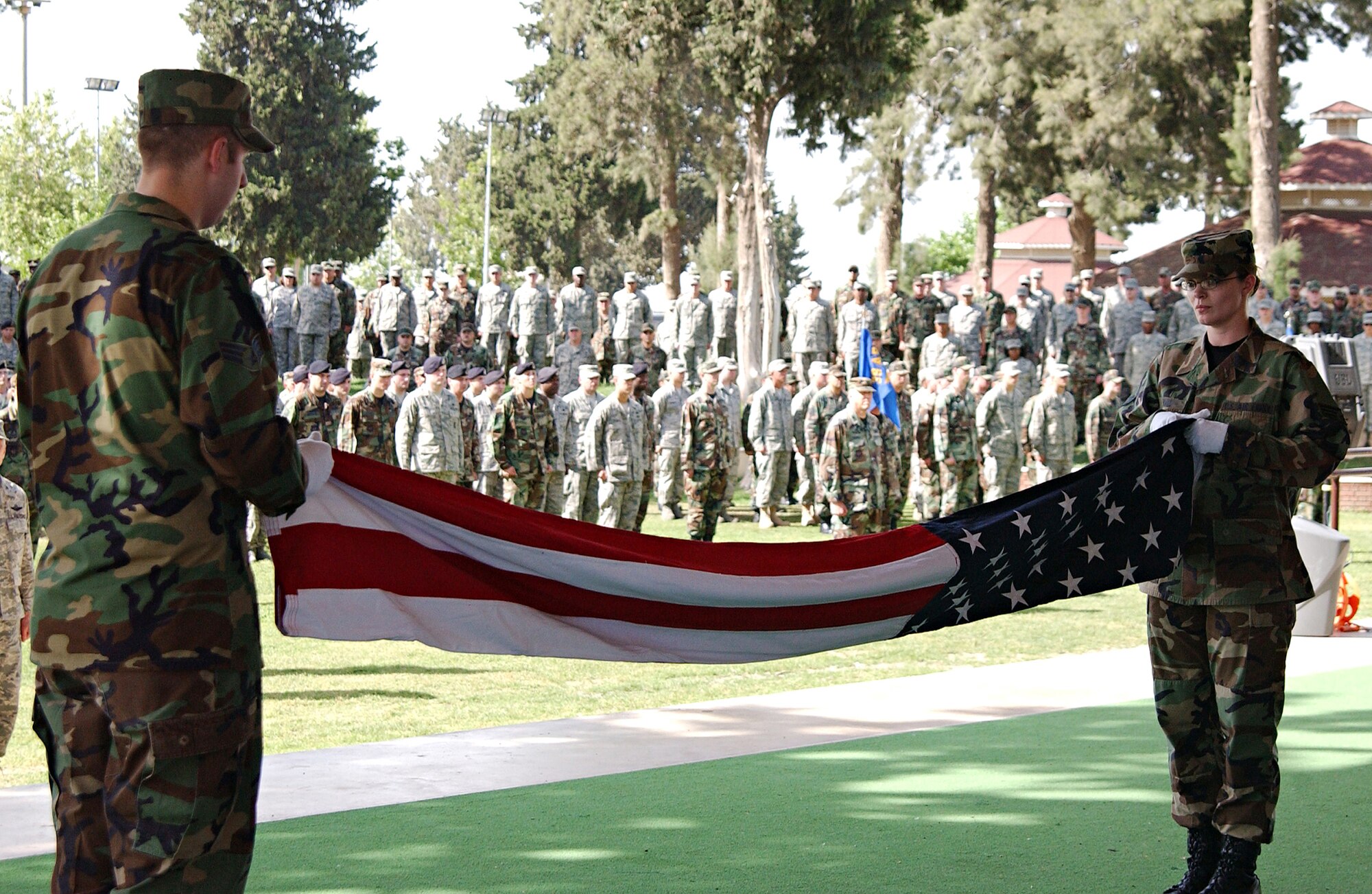 Member of the Incirlik Honor Guard fold the flag during the Memorial Day ceremony held May 23 at Arkadas Park. The program also featured a 39th Security Forces firing party. (U.S. Air Force photo by Airman 1st Class Benjamin Wilson)