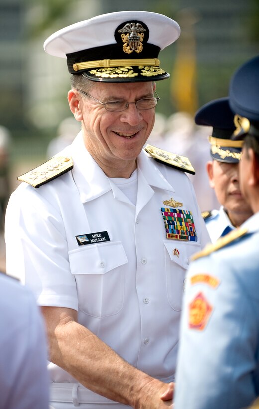 U.S. Navy Adm. Mike Mullen, chairman of the Joint Chiefs of Staff, greets Indonesian Defense Force officers after a arrival ceremony welcoming him Jakarta, Indonesia. 