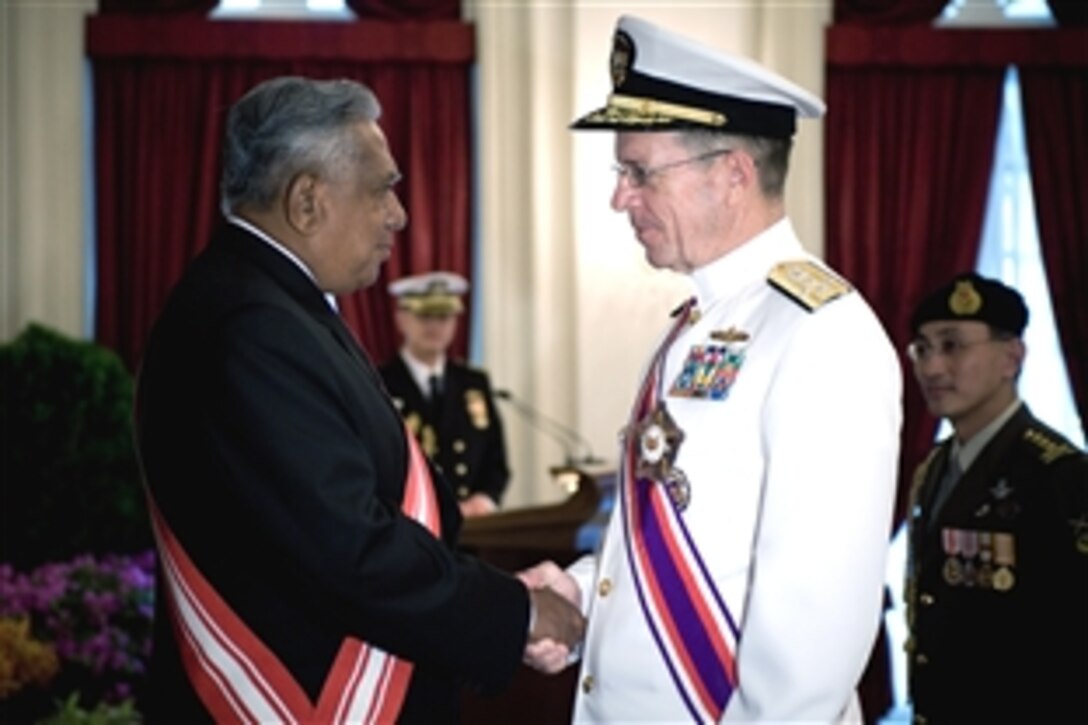 Singapore President Sellapan Ramanathan congratulates U.S. Navy Adm. Mike Mullen, chairman of the Joint Chiefs of Staff, after being awarded the Singapore Military Distinguished Service Order,  May 29, 2008. Singapore is Mullen's second stop on an eight-day tour visiting Asian-Pacific nations and attending the 2008 Shangri-La Dialogue hosted by the island nation. 