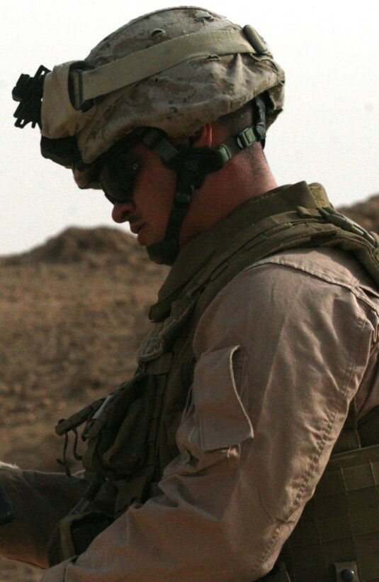 Marines stationed at Camp Al Qaâ??im, Iraq, assemble a litter to carry simulated victims during a mass casualty drill May 30. Task Force 2nd Battalion, 2nd Marine Marines, Regimental Combat Team 5, conducted the drill to test the response time of everyone on the base and to keep the Marines and sailors on their toes.