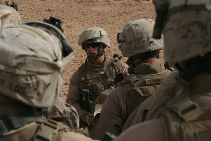Marines with Task Force 2nd Battalion, 2nd Marine Marines, Regimental Combat Team 5, rush a simulated casualty to an ambulance during a mass casualty drill at Camp Korean Village, Iraq, May 30. The scenario devised for the drill consisted of a simulated indirect fire attack on the baseâ??s Morale, Welfare and Recreation Center.
