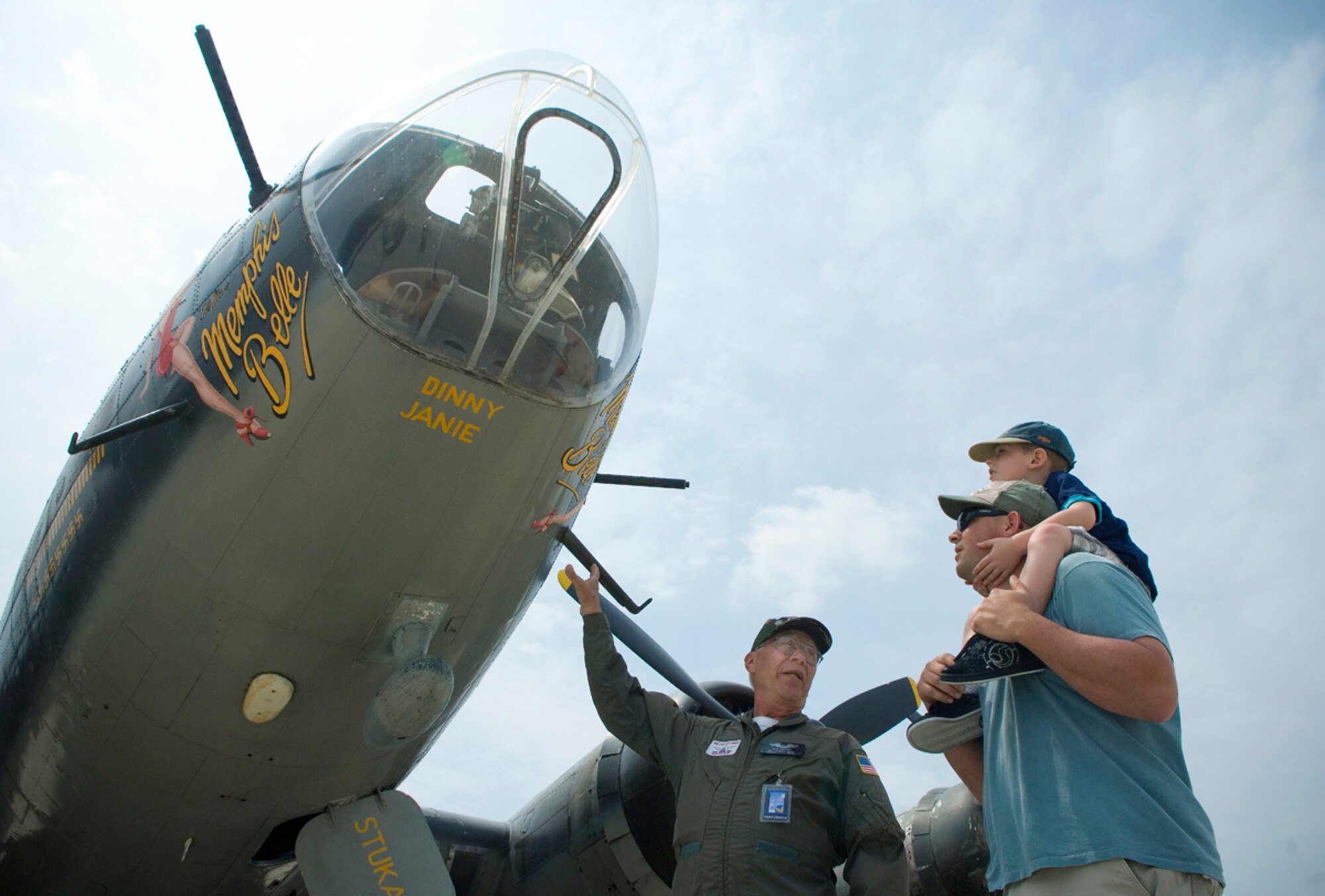 Korean War-era veteran Bob Selden shares the history of the B-17 Flying Fortress with Jason Morris and his son, Brody, during the 2008 McGuire Air Expo May 31 at McGuire Air Force Base, N.J. Base officials hosted the air expo, which concluded Air Force Week in Philadelphia. Mr. Selden is a volunteer crew member of the "Memphis Belle." (U.S. Air Force photo/Staff Sgt. Bennie J. Davis III)