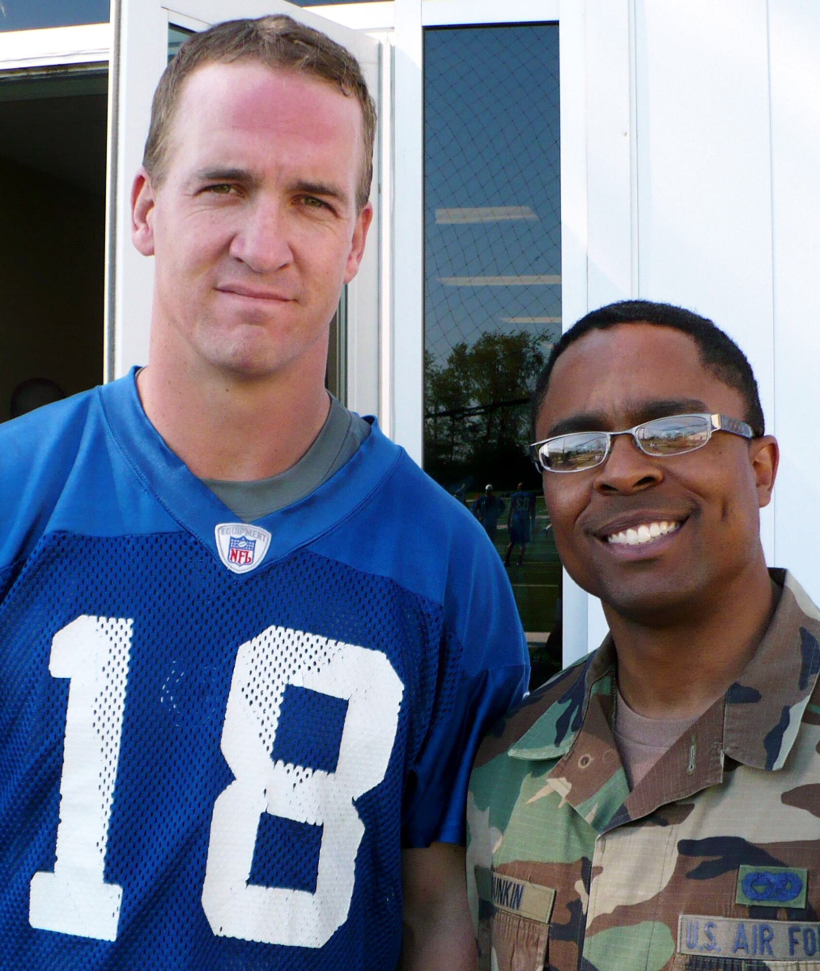 GRISSOM AIR RESERVE BASE, Ind., -- Indianapolis Colts quarterback Peyton Manning, stands with Senior Airman Keith Dunkin at the Colts mini-camp recently. Airman Dunkin, is from Tinker AFB, Okla., but is on temporary duty at Grissom working with Project TransAm. (U.S. Air Force photo) 