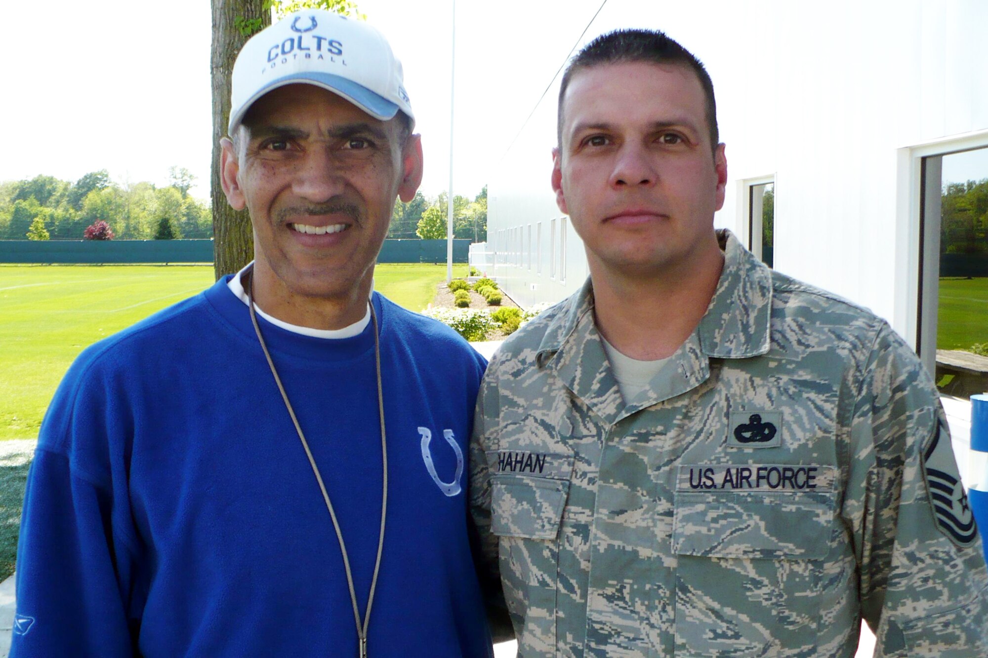 GRISSOM AIR RESERVE BASE, Ind., -- Indianapolis Colts Coach Tony Dungy stands with Master Sgt. Rob Shahan, a reservist from Tinker AFB, Okla., working at Grissom as part of the TransAM program to assist Native Americans. (U.S. Air Force photo)