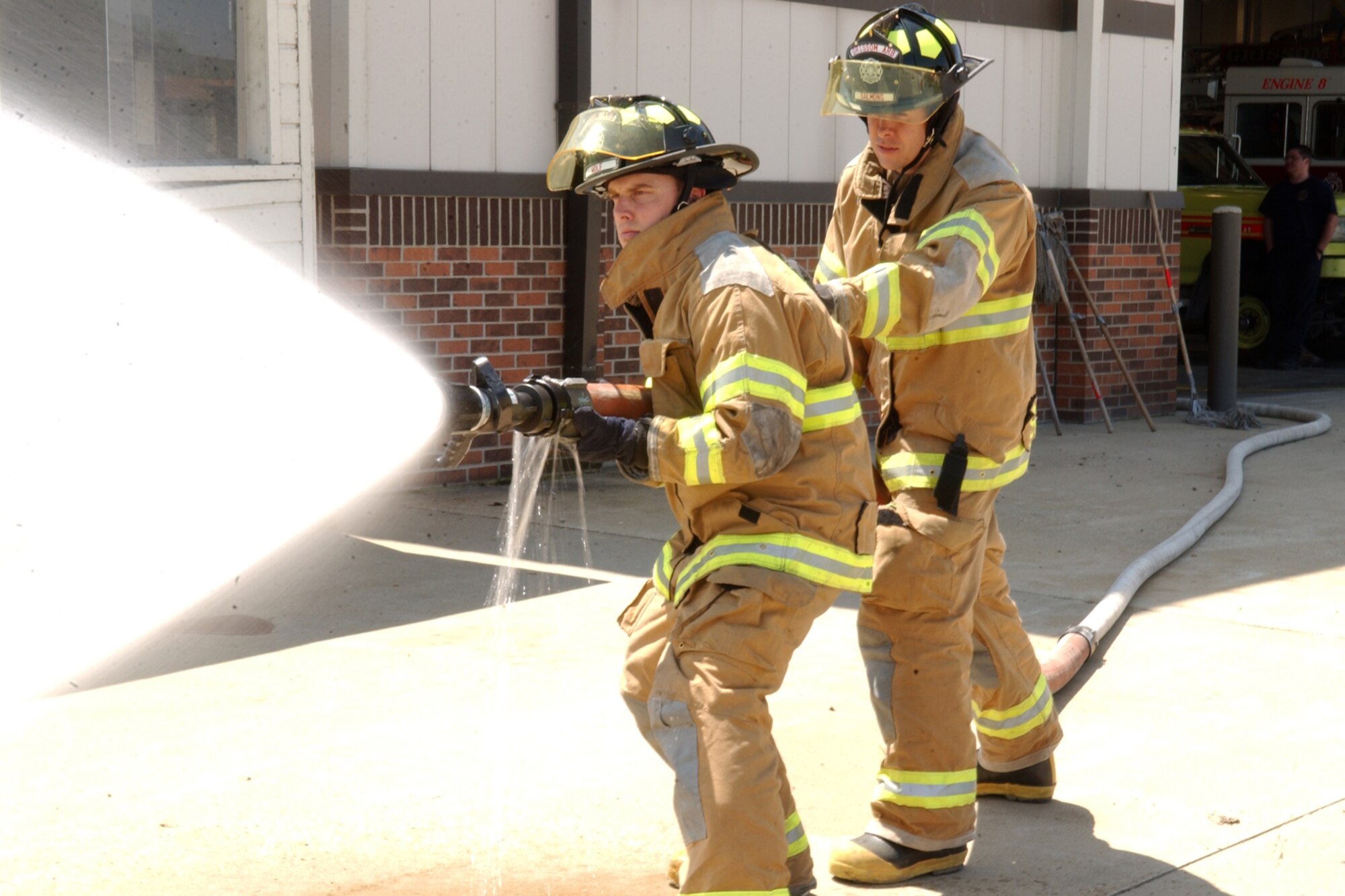 GRISSOM AIR RESERVE BASE, Ind., --  Dan Wolf, left, and Jay Salmons, Grissom Fire Department firefighters, practice their tactics and strategy. This particular tactic is called the hose line advance.  The purpose of training is to help individuals become qualified and prepared to execute specified tasks when needed. The two firemen are a part of the primary Rescue 5 crew. (U.S. Air Force photo/Senior Airman Carl Berry)