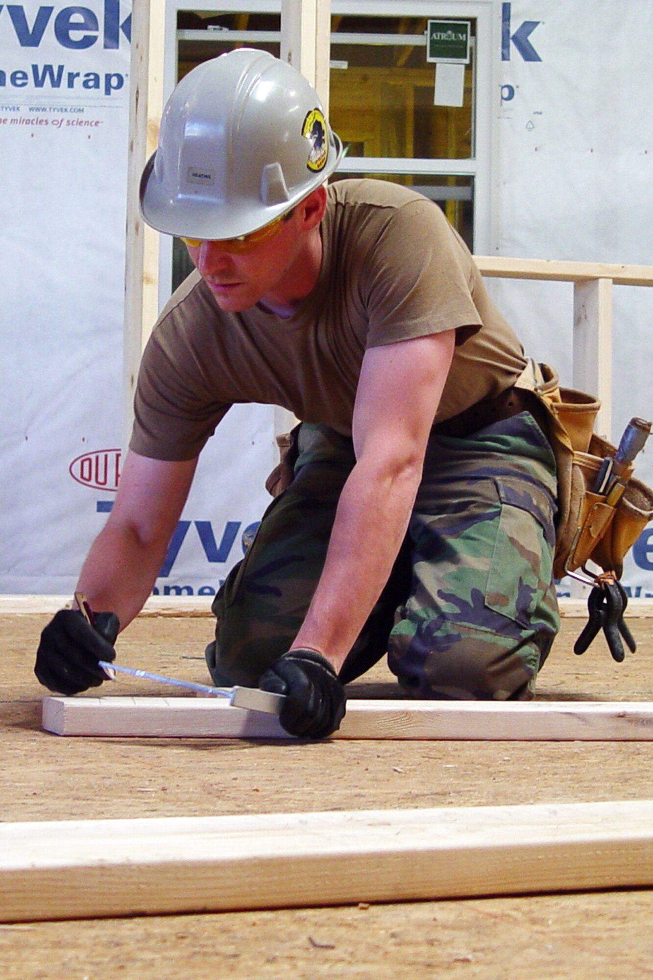 GALLUP, N.M. -- Staff Sgt. Ritchey Moore, a structural journeyman with the 434th Civil Engineers Squadron, marks the angle of a cut during the construction of a house. Sergeant Moore and other civil engineers from Grissom are currently working in New Mexico with the Southwest Indian Foundation building homes for Native Americans. (U.S. Air Force photo/Senior Master Sgt. Chuck Gill)