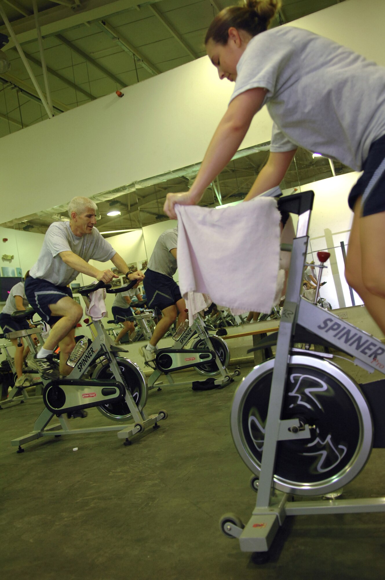 BALAD AIR BASE, Iraq -- Airmen assigned to the 332nd Air Expeditionary Wing participate in an indoor cycling class at the Red Tail Fitness Center here, May 31. Maintaining a healthy, physically fit lifestyle helps Airmen to carry out their daily duties more efficiently in a deployed environment. A typical class is between 40 and 60 minutes long. (U.S. Air Force photo/ Senior Airman Julianne Showalter)