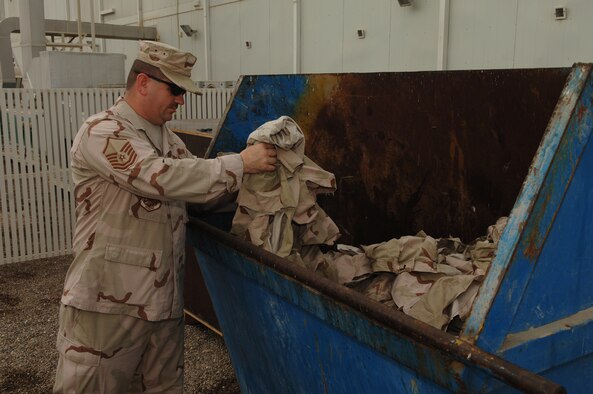 Master Sgt. Johnny Russell, 380th Air Expeditionary Wing Antiterrorism Office and Wing Inspector General Representative, inspects the unservicable uniforms bin.  Sergeant Russell was the 380th AEW Warrior of the Week for the week of May 30, 2008 (U.S. Air Force Photo/Captain Martin Gerst)