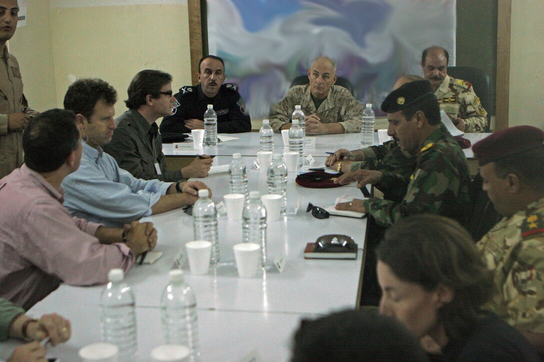 Maj. Gen. John F. Kelly, commanding general, Multi National Forces-West, speaks with members of the Brookings Institution, Harvard University and high ranking officials in the Iraqi Army and Iraqi Police during a meeting at Camp Habbaniyah May 31. The meeting was scheduled to give these "thinkers" a chance to speak to Iraqi officials in-person to assess the eventual transition of authority from the Coalition Forces to the Iraqi Security Forces in the Al Anbar province of Iraq.