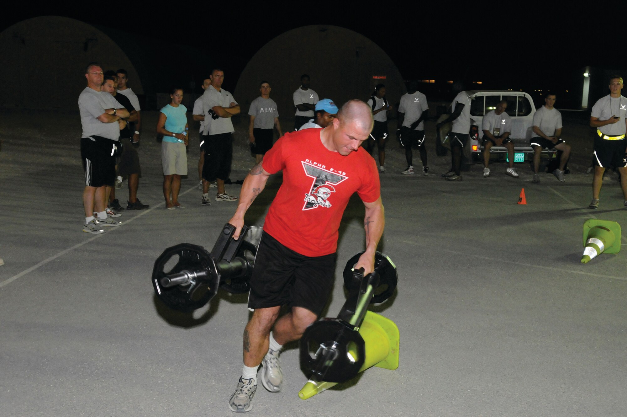 Spc. Terry Jacobs, a Patriot missile crewmember with the Army’s A 2-43 ADA Launcher Platoon, navagates the Farmers Walk at the Strong Man/Strong Mind Challenge at an undisclosed location in Southwest Asia Oct. 25. Terry finished fourth place overall in the competition. Terry Jacobs is deployed from Fort Bliss, Texas, in support of Operations Iraqi Freedom and Enduring Freedom and Joint Task Force-Horn of Africa. (U.S. Air Force photo by Tech. Sgt. Michael Boquette)