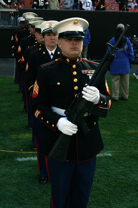 Sgt. S.C. Block leads the 3rd Battalion, 25th Marine Regiment, rifle detail as they prepare to march out for a 21-gun pregame salute Nov. 2, 2008, at Cleveland Browns Stadium. The pregame also included a joint-service color guard, re-affirmation ceremony, flag presentation and an F/A-18 Hornet fly-over.