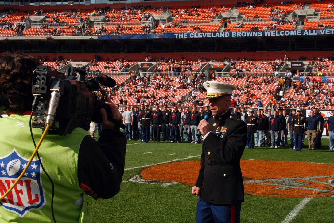 Maj. Charles R. Cassidy, the commanding officer of Recruiting Station Cleveland, leads more than the 100 Marine poolees in re-affirming their oath of enlistment ceremony at Cleveland Browns Stadium Nov. 2, 2008 in a Veterans Day ceremony before the Cleveland Browns vs. Baltimore Ravens football game. The pregame also included a fly-over of two F/A-18 Hornets provided by Marine All-Weather Fighter Attack Squadron 533, 2nd Marine Aircraft Wing; Marine Corps 21-gun salute, America-shaped flag, and a joint color guard.
