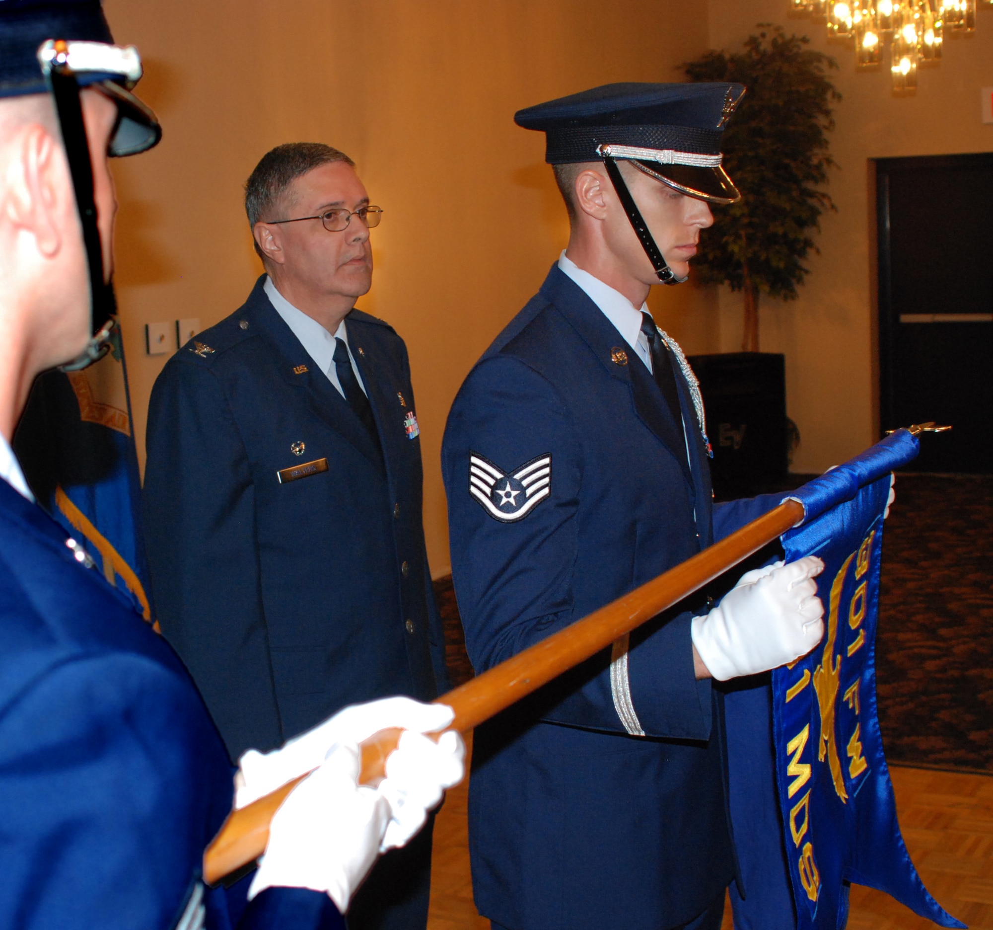 (center) Col Richard Walters, new 301st Medical Squadron commander, observes Staff Sgt. Todd Ryan, 301st MDS member, unfurling the guidon during the recent reactivation of the 301st MDS. November 2 was a historical date for the medical squadrons in the 301st Fighter Wing as the 701st Medical Squadron and 301st Aerospace Medicine Squadron merged to form the only unit's medical squadron, the 301st MDS. (U.S. Air Force Photo/Tech. Sgt. Stephen Bailey)