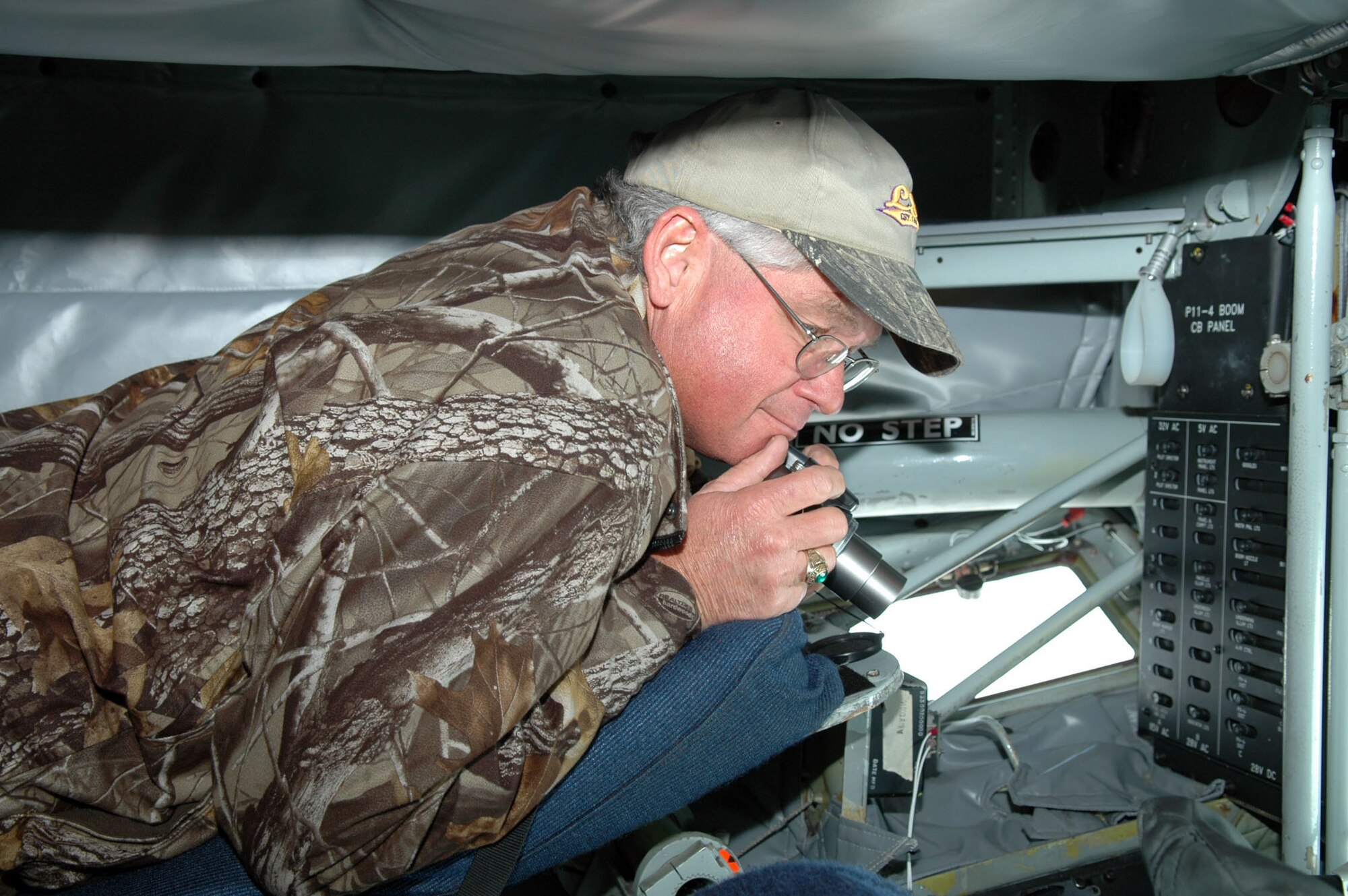 John Jeter of the Bossier City, La., Police Department explores the boom operator's station during an orientation flight aboard a KC-135 aircarft as part of the 917th Wing Employer Appreciation Day event held Nov. 1 at Barksdale Air Force Base, La.  Fourteen employers of Barksdale reservists participated in a refueling mission involving the A-10 and B-52 aircrafts, as well as got an inside look at the wing's mission. (U.S. Air Force Photo/Master Sgt. Mary Hinson)