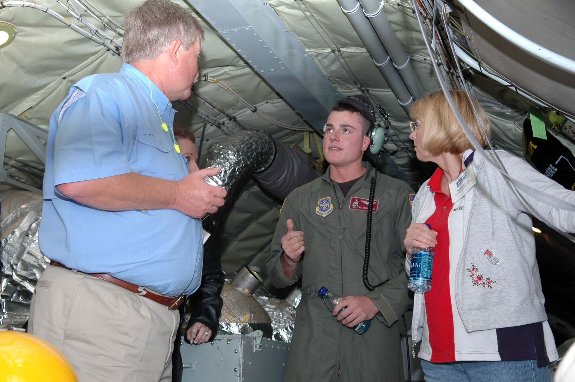 Airman 1st Class Andrew Deck, a boom operator aboard a KC-135 from McConnell Air Force Base, Kan., talks about his job and the Air Force Reserve with employers of Barksdale Air Force Base, La., reservists during the 917th Wing Employer Day event held Nov. 1 at Barksdale.  Fourteen employers had the opportunity to participate in a refueling mission involving the A-10 and B-52 aircrafts, as well as get an inside look at the wing, Air Force Reserve and Employer Support of Guard and Reserve missions. (U.S. Air Force Photo/Master Sgt. Mary Hinson)