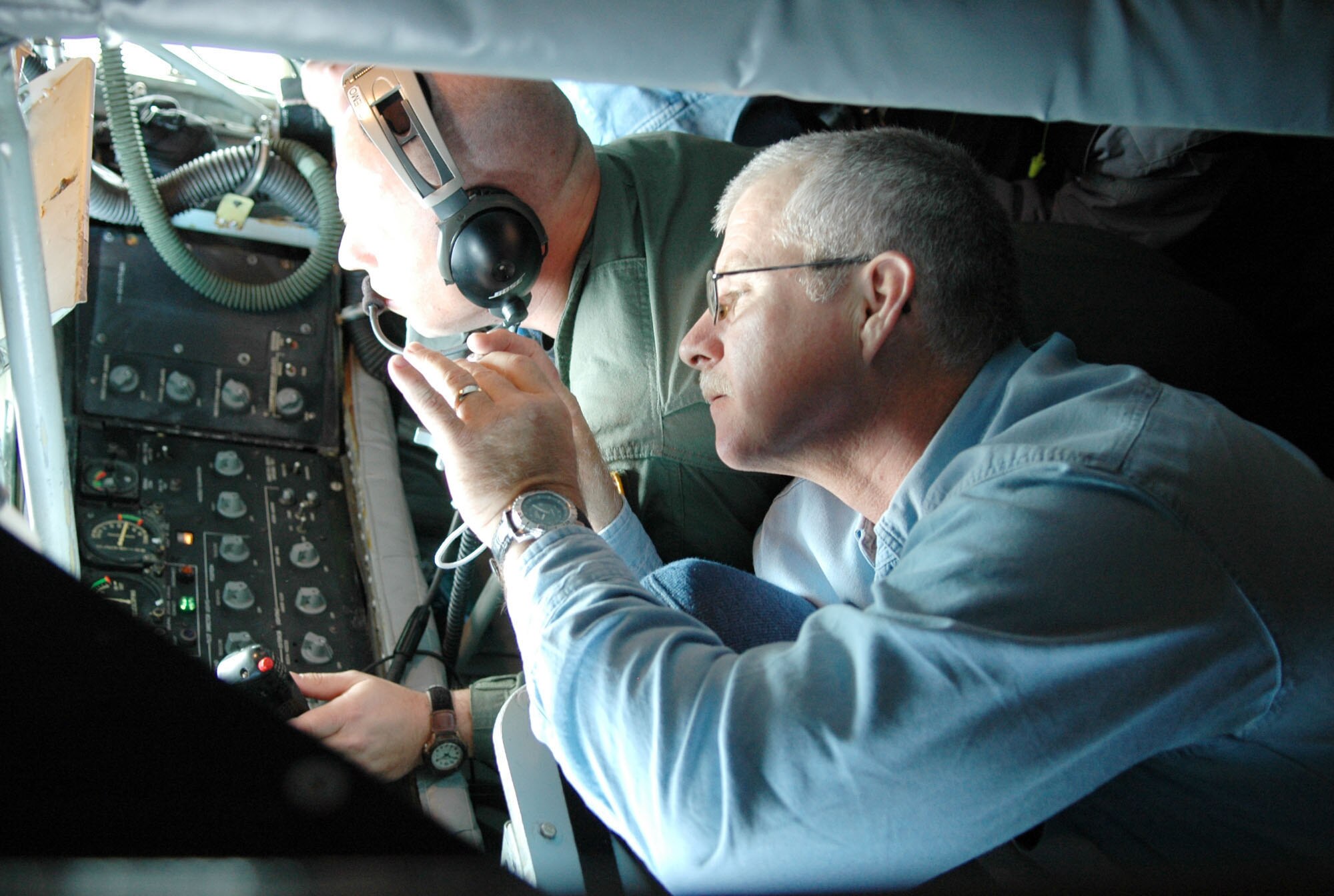 Tech. Sgt. Clay Dotson, a boom operator aboard a KC-135 from McConnell Air Force Base, Kan., refuels an A-10 aircraft while Richard Nunnery of the Bossier City, La., Police Department takes pictures during the 917th Wing Employer Appreciation Day event held Nov. 1 at Barksdale Air Force Base, La.  Fourteen employers of Barksdale reservists had an opportunity to participate in a refueling mission involving the A-10 and B-52 aircrafts. (U.S. Air Force Photo/Master Sgt. Mary Hinson)