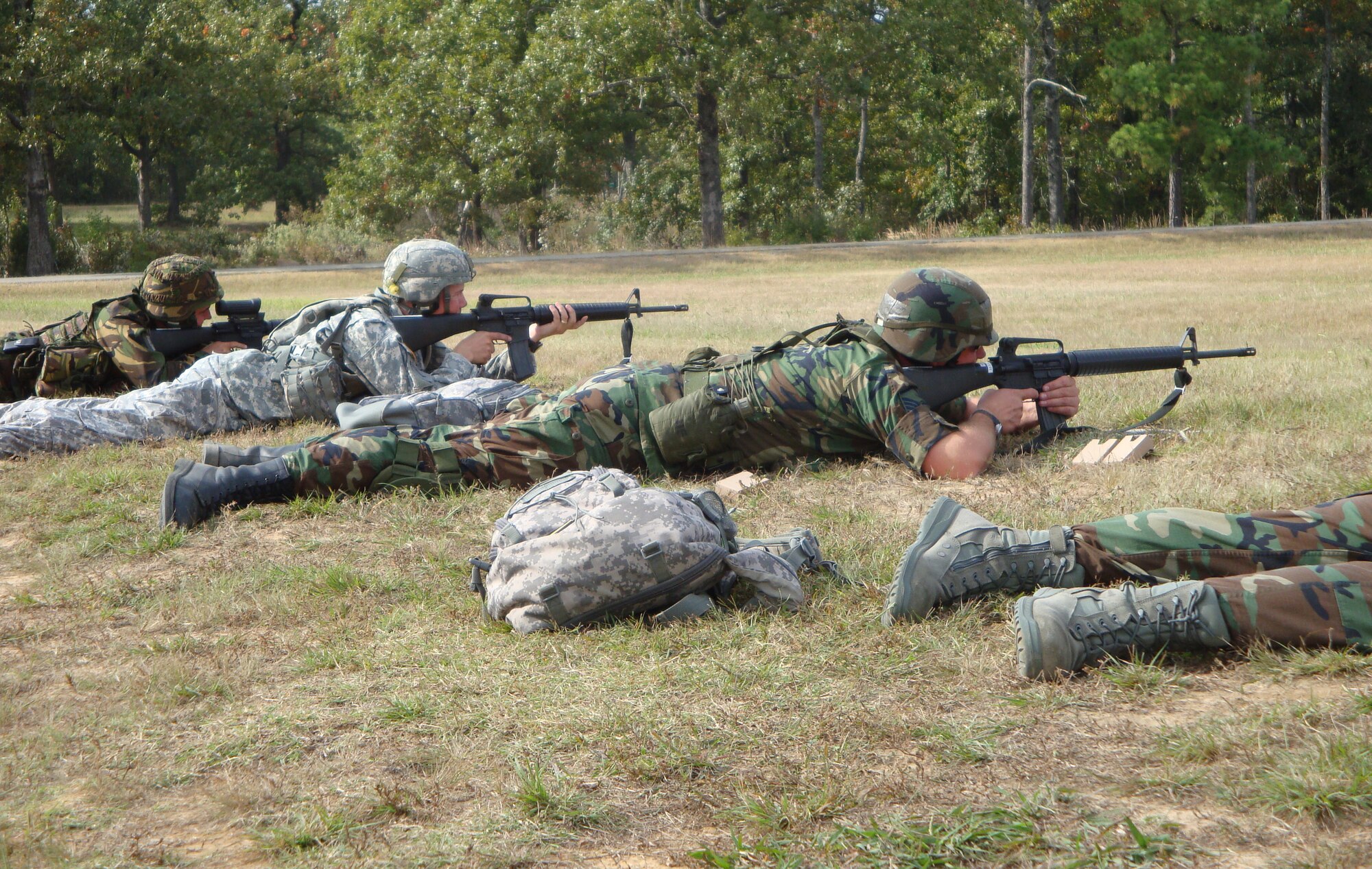 Master Sgt. Rocky Shaffer (center), 151st Logistics Readiness Squadron, fires the standard issue M-16 during a rifle match in the Winston P. Wilson National Shooting match in Little Rock, Ark. on October 13.  Sergeant Shaffer was part of 18 Utah Army and Air National Guardsmen that competed in the three day match.      
U.S. Air Force photo 