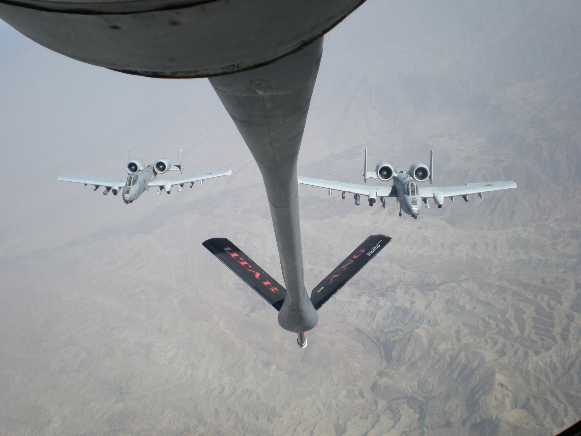 Two A-10s wait to be refueled by a KC-135 during a mission in Afghanistan. Members of the 47th Fighter Squadron deployed and flew with the Willow Grove, Penn., Air National Guard A-10 unit, as they conducted missions supporting the International Security Assistance Forces, as well as U.S. and NATO forces in support of Operation Enduring Freedom.