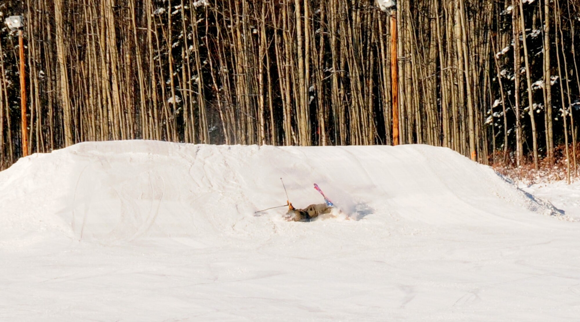 After catching air, a skier wipes out Nov. 1, 2008, at Birch Hill Ski Resort on Fort Wainwright, Alaska. Wearing proper protective gear will minimize injuries. (U.S. Air Force photo/Airman Laura Max)