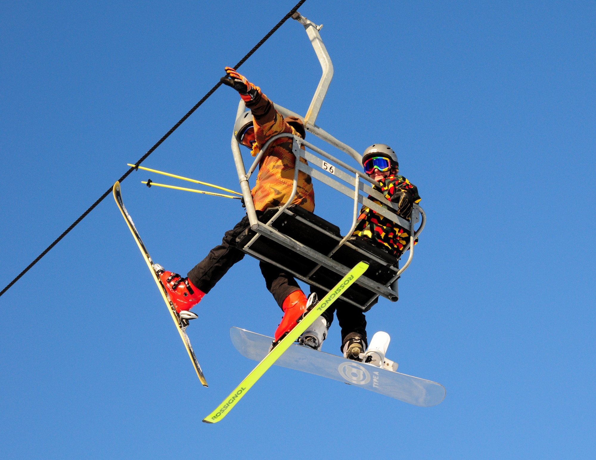 Two outdoor enthusiasts enjoy riding the ski lift Nov. 1, 2008, at Birch Hill Ski Resort on Fort Wainwright, Alaska. On a clear day, resort visitors can view Mount McKinley on a scenic ride to the top. (U.S. Air Force photo/Airman Laura Max)