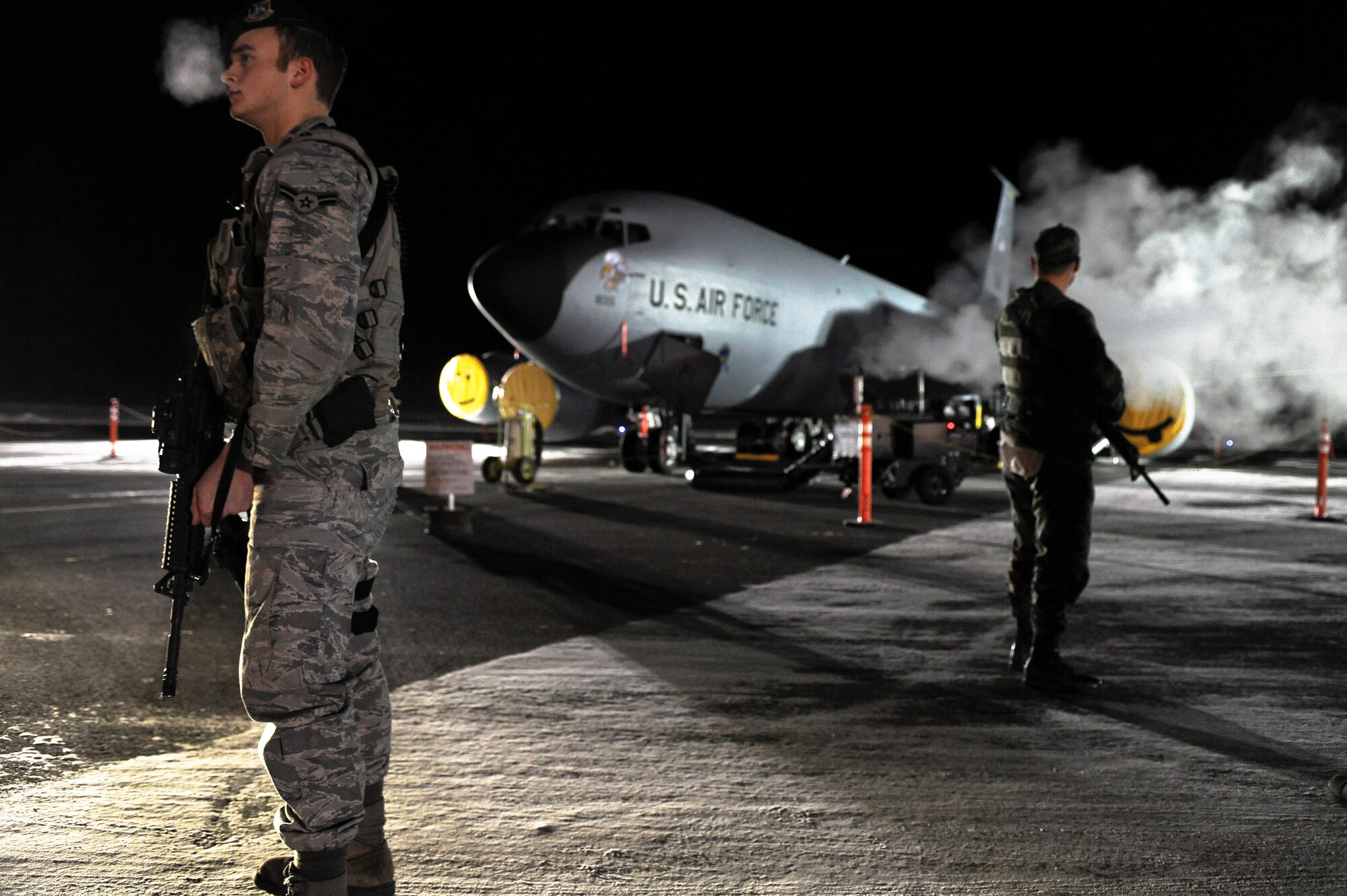 Airman 1st Class Tony Gross and Airman 1st Class Laurence Tognetti stand guard in front of a KC-135R Stratotanker during a 354th Fighter Wing and 168th Air Refueling Wing combined Operational Readiness Exercise Nov. 1, 2008, at Eielson Air Force Base, Alaska. The 354th FW ensures success of the 168th ARW mission, which is to train and equip KC-135R combat crews to provide air refueling in support of operations in the Pacific region. Airman Gross is assigned to the 354th Security Forces Squadron. Airman Tognetti is assigned to the 354th Aircraft Maintenance Squadron.  (U.S. Air Force photo/Senior Airman Jonathan Snyder)