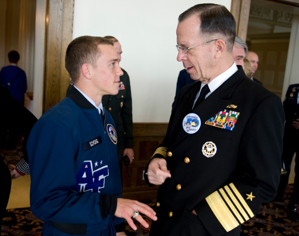 Navy Adm. Mike Mullen, chairman of the Joint Chiefs of Staff, speaks with U.S. Air Force Academy Cadet  Wing Commander Jacob Schonig before the Army vs. Air Force football at the U.S. Military Academy in West Point, N.Y., Nov. 1, 2008.