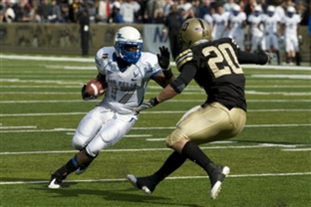 U.S. Air Force Academy quarterback Aster Clark attempts to avoid a tackle by U.S. Military Academy Black Knight defensive back Lowell Garthwaite in West Point, N.Y., Nov. 1, 2008. The Air Force defeated Army 16-7 in their annual gridiron battle.