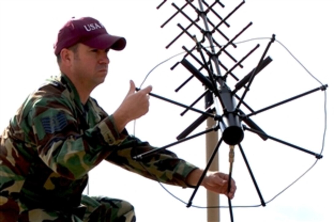 U.S. Air Force Tech. Sgt. Don Colbert, course director for the Air Force Expeditionary Center's Mobile Command, Control and Communications Systems Course, adjusts an antenna on the hard-sided expandable lightweight air mobile shelter in the mobility operations school's mobile C3 training facility on Fort Dix, N.J., Oct. 29, 2008. 